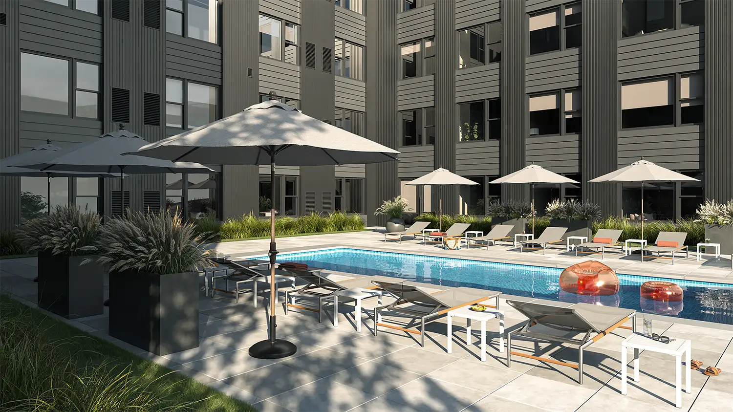 The Mercer | Outdoor Pool | A resort-style outdoor pool designed for warm-weather lounging and socializing.